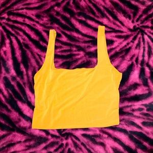 Gold color crop-top.